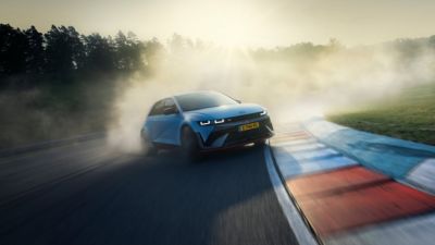 The all-electric Hyundai IONIQ 5 N driving on the at the Nürburgring racetrack.