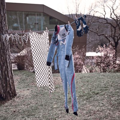 Hyundai overall and racing gear hanging on a leash.