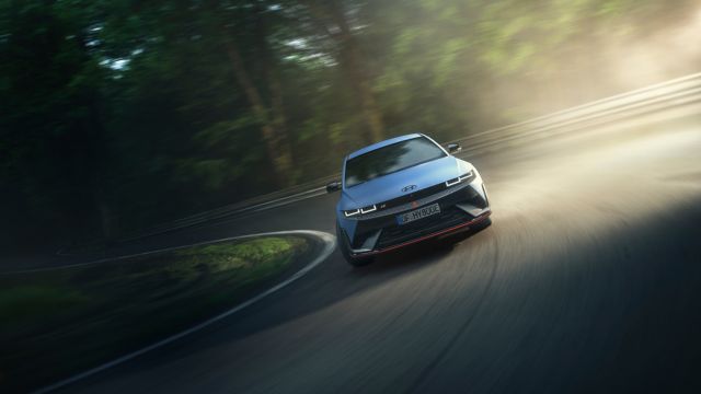 The all-electric Hyundai IONIQ 5 N driving through a curve.