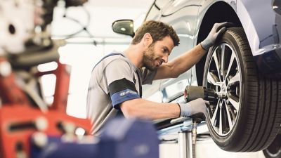 Hyundai technician working on a Hyundai vehicle