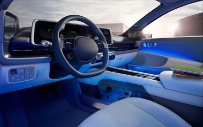 The interior of the Hyundai IONIQ 6  EV with blue Dual Color Ambient Lighting.