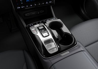 The shift by wire controls with the ergonomical arm rest in the Hyundai TUCSON Plug-in Hybrid SUV.