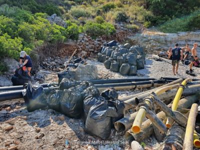 Debris salvaged by Healthy Seas volunteers, bagged up and waiting for transport in Ithaca, Greece.
