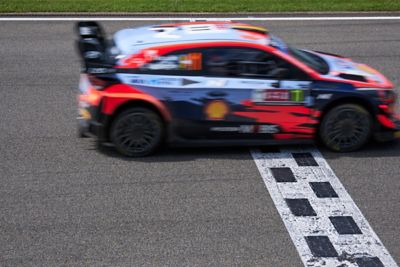 The Hyundai i20 Coupe WRC on the track from the side.