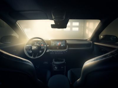 Inside view of the Hyundai IONIQ 5 N and its driving wheel and boarding panel. 