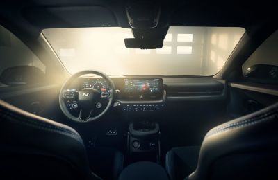 The sporty cockpit of the all-electric Hyundai IONIQ 5 N seen bathed in sunlight.