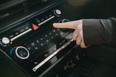 Driver using the instrument panel on the dashboard 