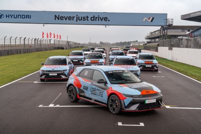 A woman checking technical car data on her computer.