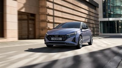 The Hyundai i20 parked alongside a wall