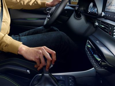 A man operating the 6-speed iMT in an Hyundai i20