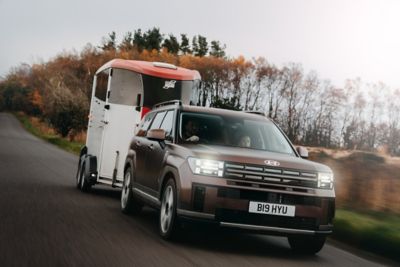 Hyundai SANTA FE on the road with a trailer