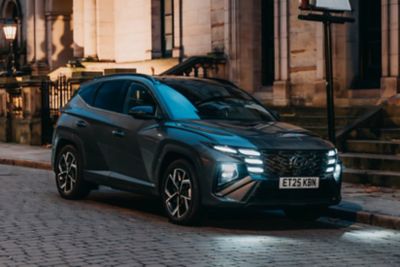 Hyundai TUCSON Hybrid N Line parked on roadside.