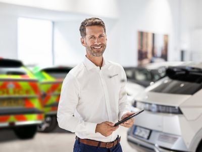 Hyundai fleet team member in front of Emergency Services vehicles