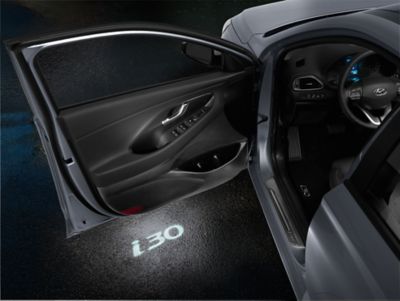 The Hyundai i30 Wagon LED door projectors with the i30 logo projected on the ground. 