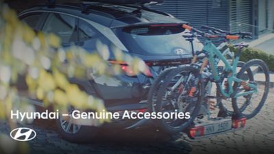A Hyundai Tucson with a bike rack from Hyundai Genuine Accessories.