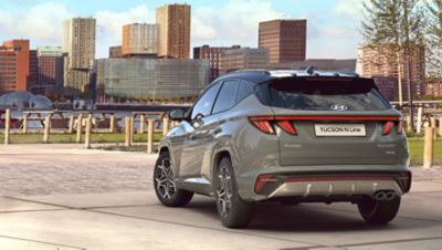 3/4 rearview of the all-new Hyundai TUCSON Hybrid N Line in shadow gray.