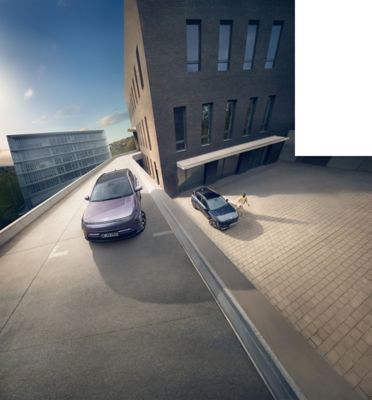 Hyundai's family of electrified cars parked in front of Central Station in a modern cityscape.