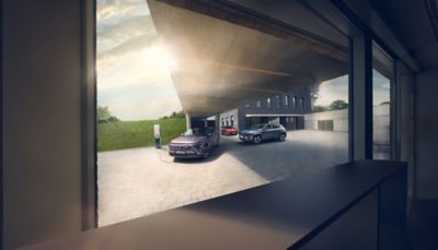 Hyundai's family of electrified cars parked in front of a cityscape.