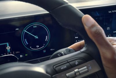 The inside of the Hyundai KONA showing the steering wheel and the centre display.