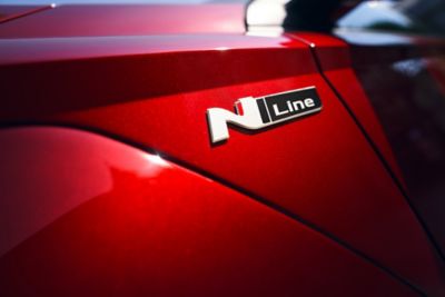 The Hyundai N Line badge on a red Hyundai vehicle.