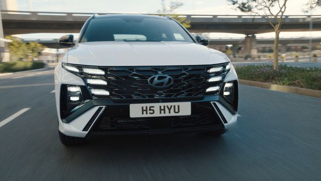 Hyundai TUCSON Hybrid being driven on the road.