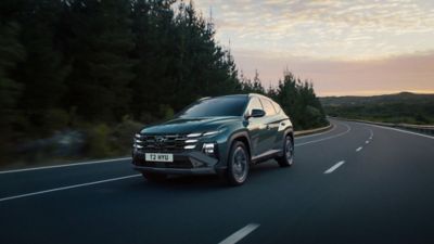 The Hyundai TUCSON driving along the road