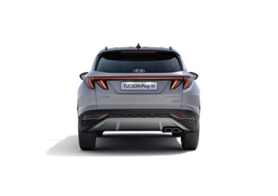The Hyundai TUCSON Plug-in Hybrid compact SUV pictured from the rear with its wide LED tail lamps.
