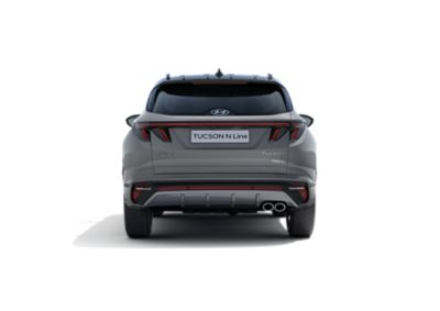 The all-new Hyundai TUCSON Hybrid N Line in shadow gray, seen from the rear.