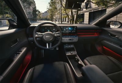 The sporty interior of the Hyundai KONA Electric N Line with red accents.