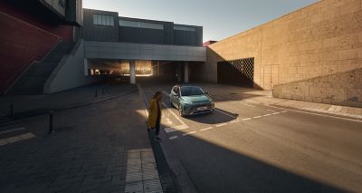 The Hyundai BAYON compact crossover SUV on a pedestrian crossing.