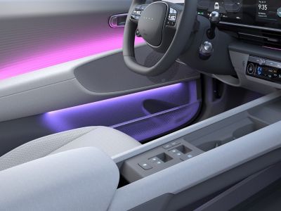 The interior of the Hyundai IONIQ 6 with purple light on the doors 