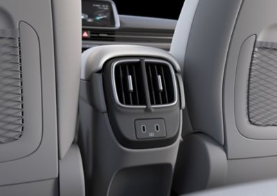 Power outlet with 2 usb chargers in the front inside the Hyundai IONIQ 6. 