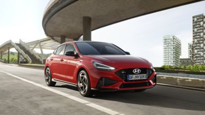 The Hyundai i30 N Line Fastback pictured from the passenger side front.