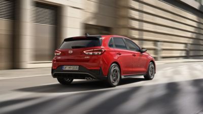 Rear view of Hyundai i30 driving on the city street.