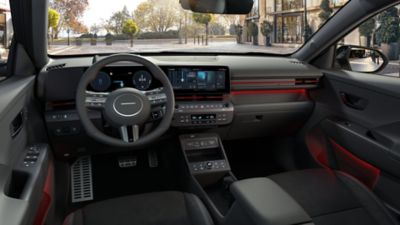 The sporty interior of the all-new Hyundai KONA Electric N Line with red accents.