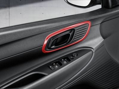 Hyundai BAYON Door handle trims accessory in tomato red.