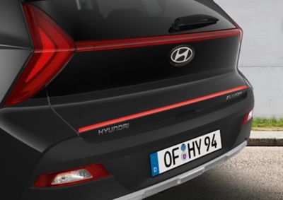 Hyundai BAYON Tailgate trim line accessory in tomato red.