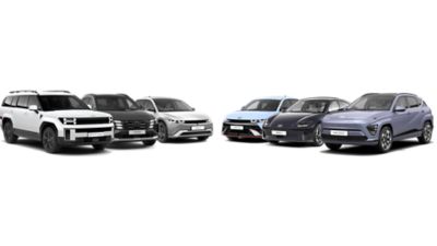 5 Hyundai vehicles parked next to each other:  SANTA FE, TUCSON, IONIQ 5, IONIQ 6 and KONA.
