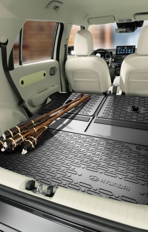 Hyundai INSTER Trunk liner with extension protection accessory.
