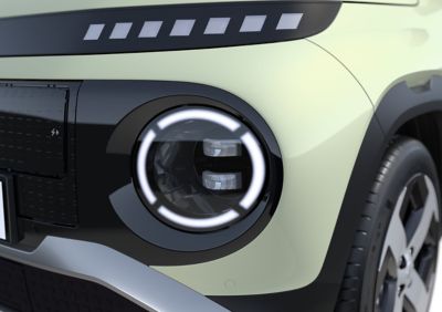 Closeup of the LED projection headlamps of the new Hyundai INSTER small electric car.