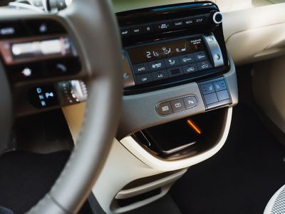 Closeup of the wireless charging port of the new Hyundai INSTER small electric car.