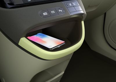 Closeup of the wireless charging port of the new Hyundai INSTER small electric car.