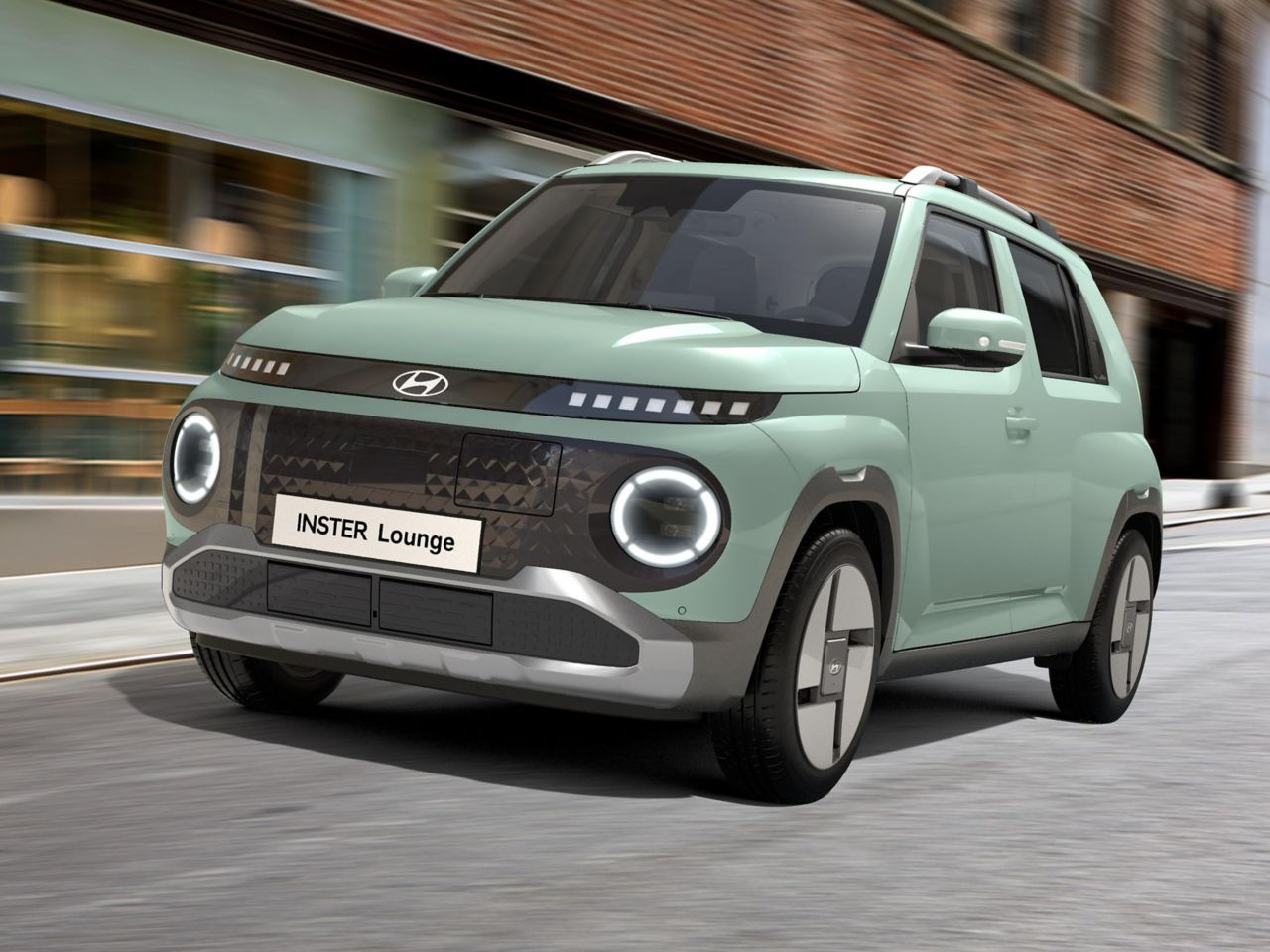 Glow Mint színű Hyundai INSTER Lounge az utcán halad. Közeli felvétel.