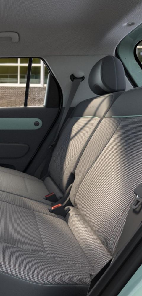 Rear seats of the Hyundai INSTER Lounge decorated with supple leather and fabric upholstery.