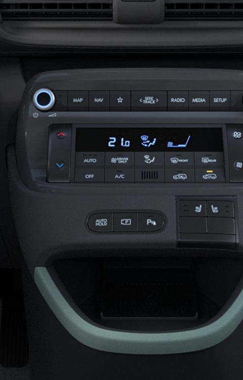 Hyundai INSTER Lounge's centre console with mint green accents.