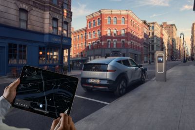 Fleet manager checking vehicle location on a tablet.