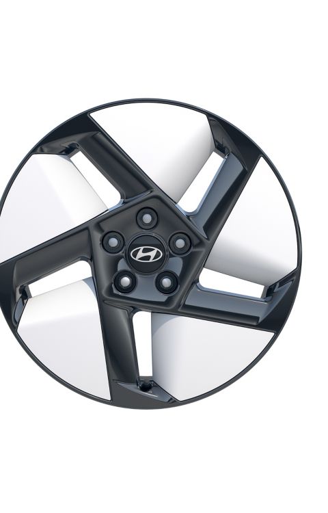 Close up of alloy wheel on Hyundai IONIQ 3 in Ice Blue Pearl exterior colour.