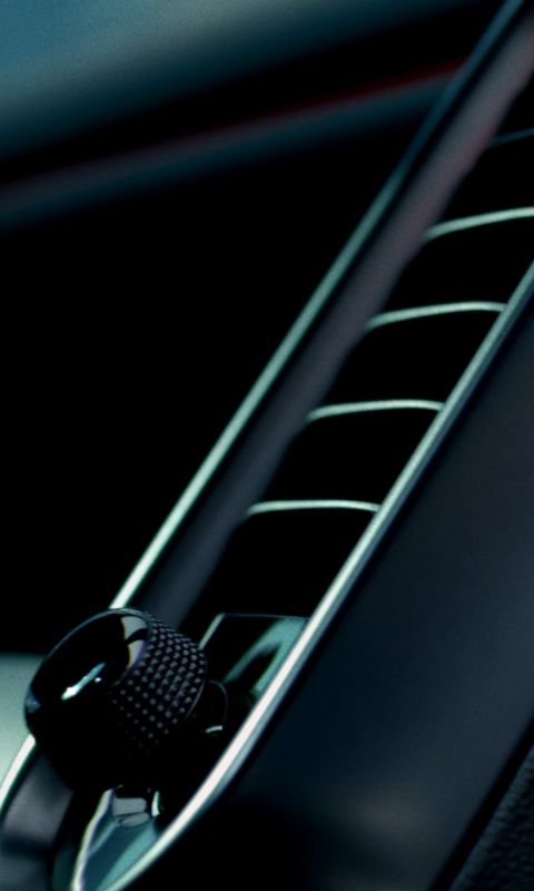 Hyundai IONIQ 3 interior air vents close-up in black and metallic silver.