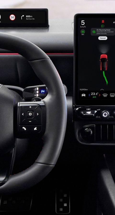 Close up of N Line steering wheel, center display inside the black Hyundai IONIQ 3 N Line interior.
