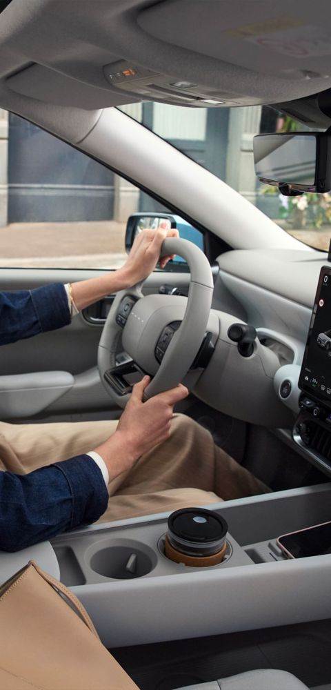 Woman in the driver's seat inside the Hyundai IONIQ 3.